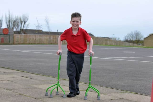 Alfie Smith making great progress with his quad sticks after his operation.