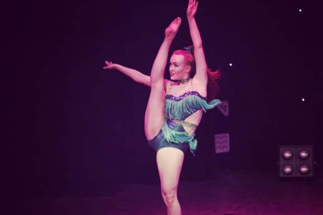 A dancer shows of her moves in the KR Dance production.