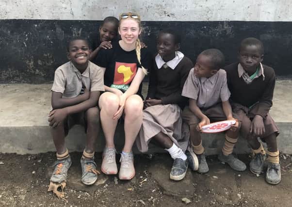 Louise Atkinson with some of the children she spent time with in Kenya