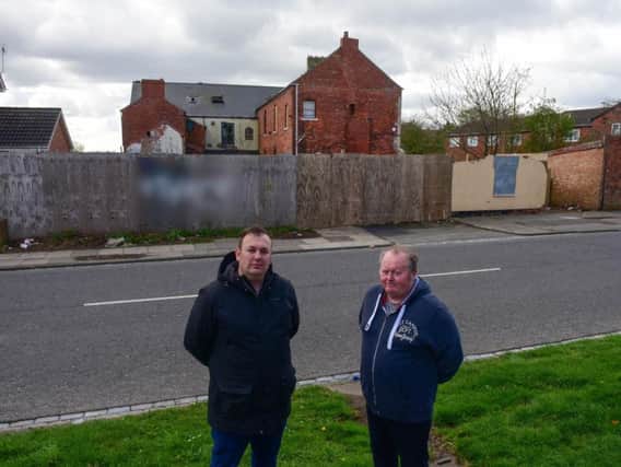 Councillors Stephen Akers-Belcher (left) and Allan Barclay at The Manor House, Owton Manor Lane, Hartlepool, which has been the target for vandals