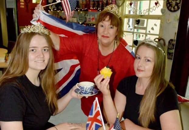 Maria Seymour (centre) with Place In The Park Coffee Shop staff Megan Angus (left) and Samantha Crowther ready for the Royal Wedding. Picture by FRANK REID
