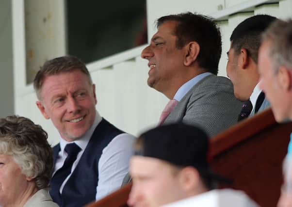 Hartlepool Uniteds director of football Craig Hignett and owner Raj Singh in the stands.