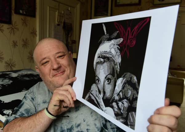 Andrew Forcer, of Park Road, Hartlepool who suffers from Fibromyalgia, has written a song to raise money for the treatment of the illness. He's pictured with the album cover, which he has painted.