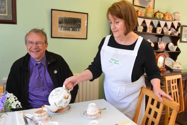 Bishop of Durham Paul Butler enjoys a cup of tea Horden Heritage Centre's Maureen McGregor