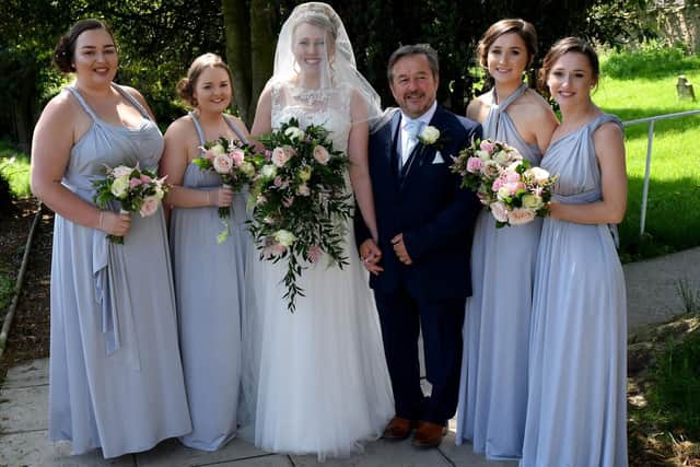 Rebecca Wilkie with her dad Kevin and bridesmaids at St Mary Magdalene Church Hart Village. Picture by Frank Reid
