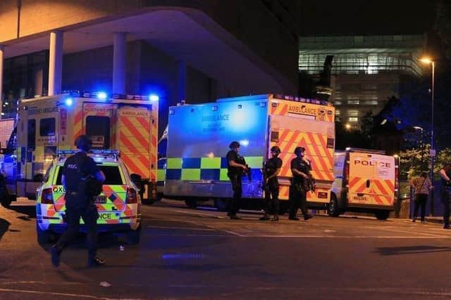 Armed police at Manchester Arena after reports of an explosion at the venue during an Ariana Grande gig. PRESS ASSOCIATION Photo. Picture date: Monday May 22, 2017. See PA story POLICE Explosion. Photo credit should read: Peter Byrne/PA Wire