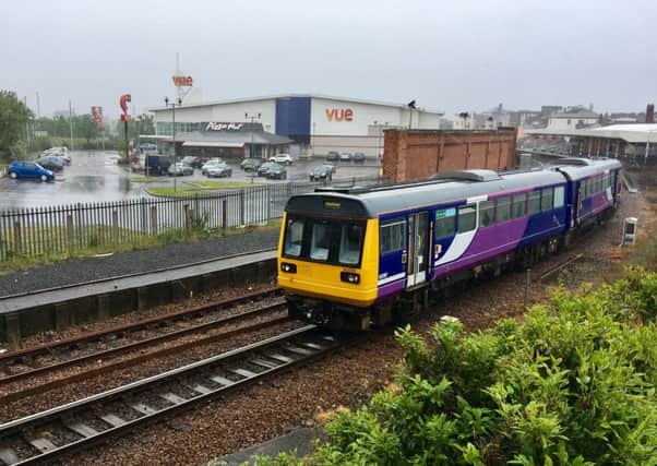 A two-carriage Northern Rail service to Newcastle pulling out of Hartlepool Rail Station.