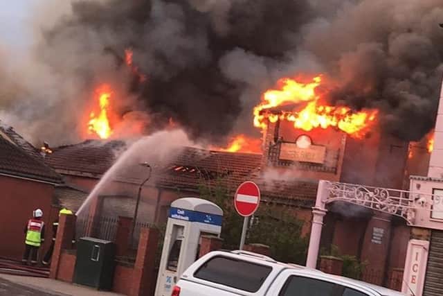 Firefighters fight the flames at the Longscar Centre. Photo by John David McDade.