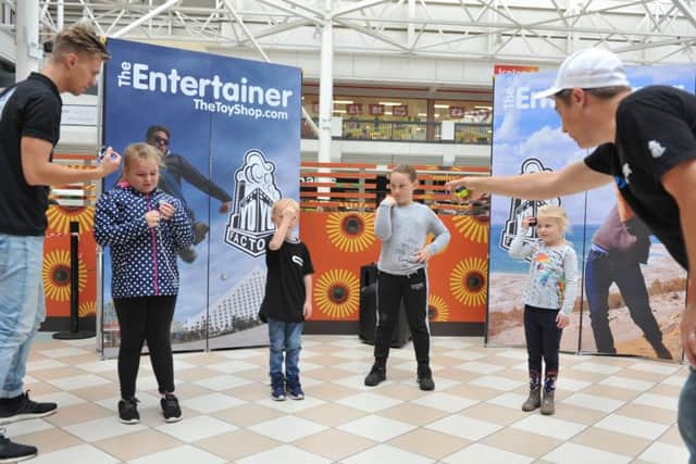 Yo-yo experts Gentry Stein and YoHans, show off their skills to youngsters in Hartlepool's Middleton Grange Shopping Centre.