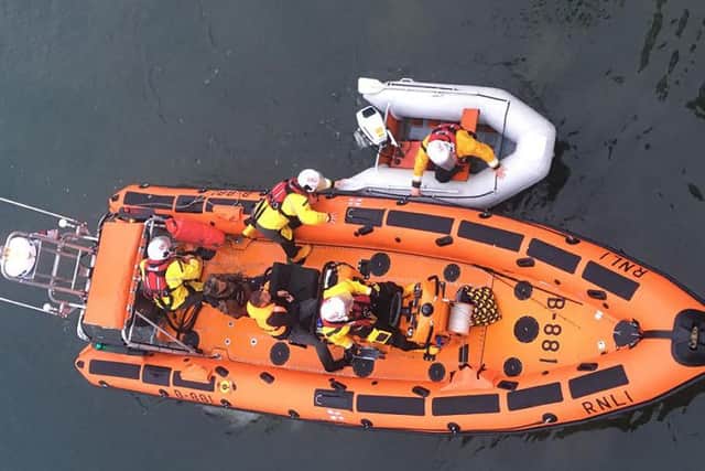 Hartlepool RNLI inshore lifeboat with the two casualties on board and the dinghy alongside. Pic by Tom Collins.